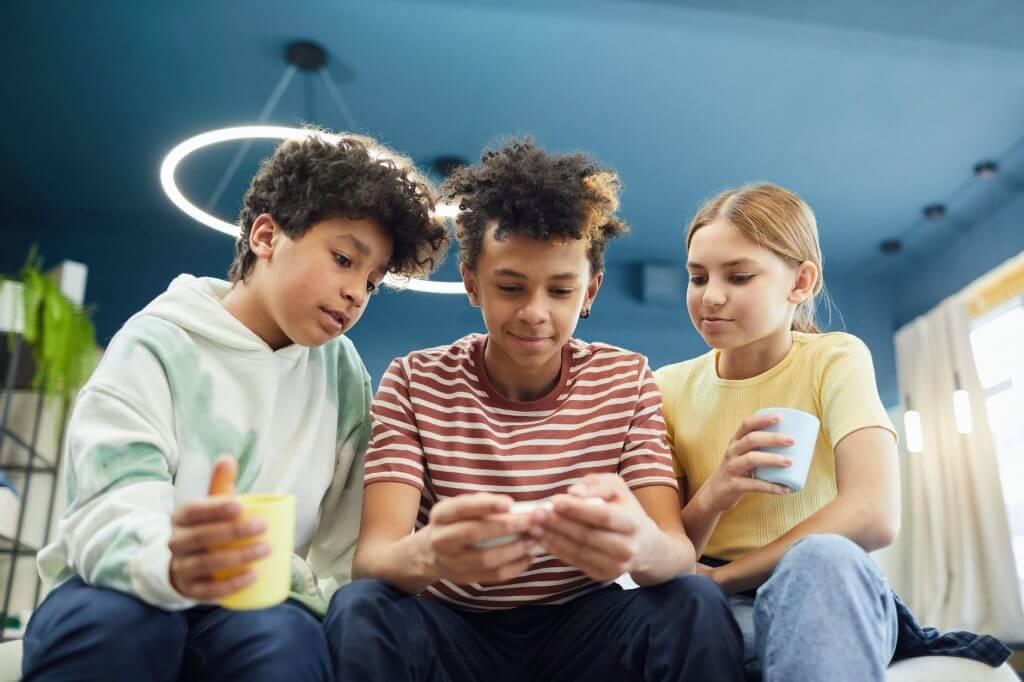 group of diverse friends using smartphone
